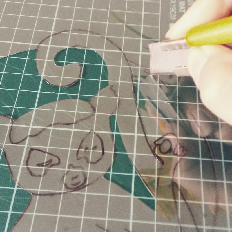 Cutting out the lemur stencil from thin acetate